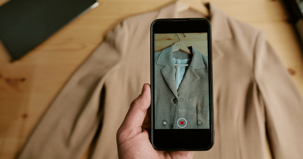 Someone taking a photo of a piece of clothing